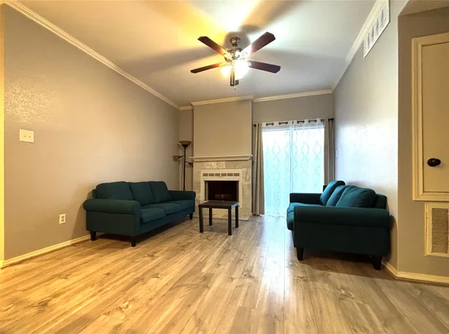 a living room with furniture and a fireplace