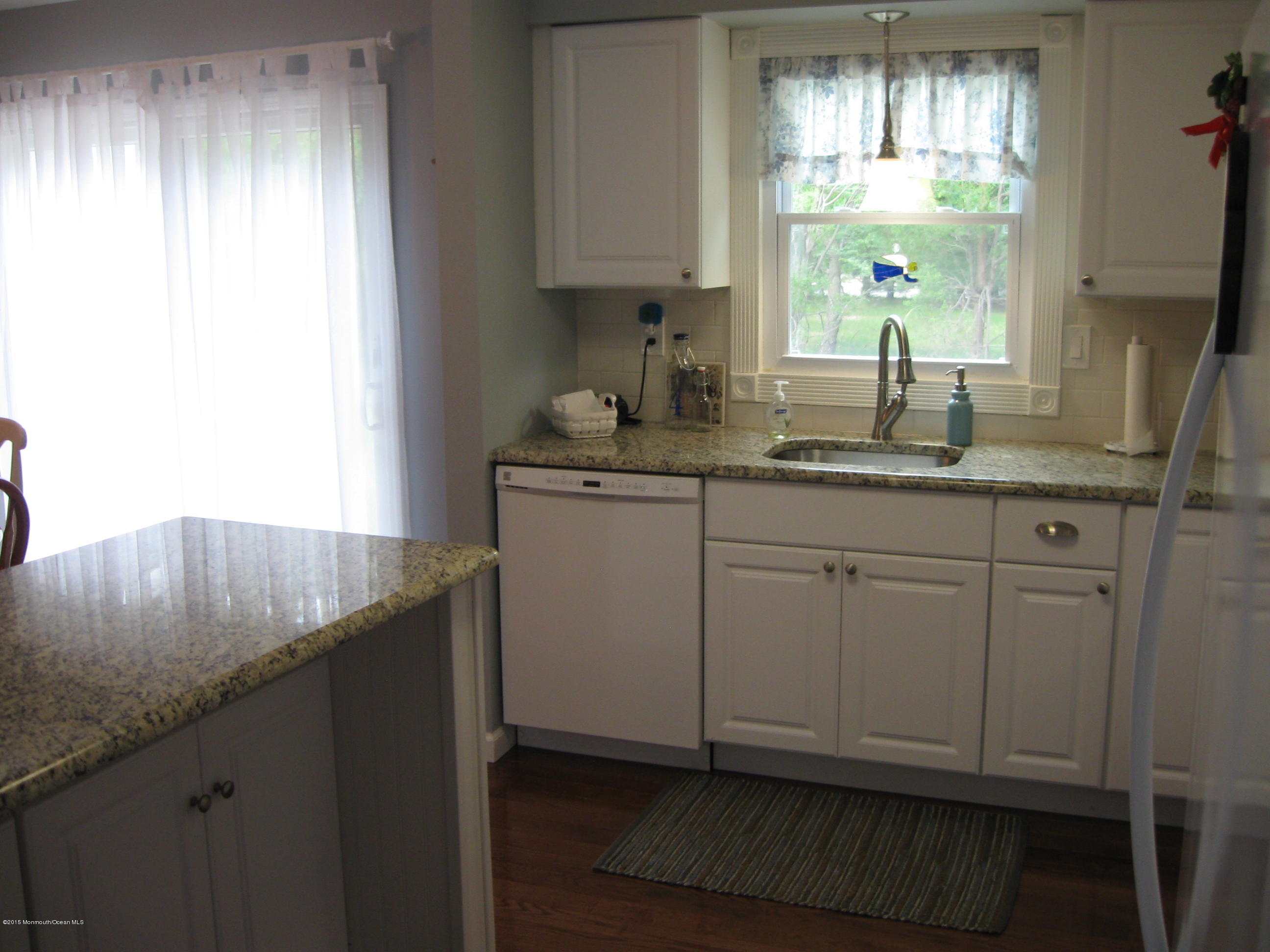 117 Georgetown Road Toms River, NJ 08757 - Photo 7 of 21 a kitchen with granite countertop white cabinets and a sink