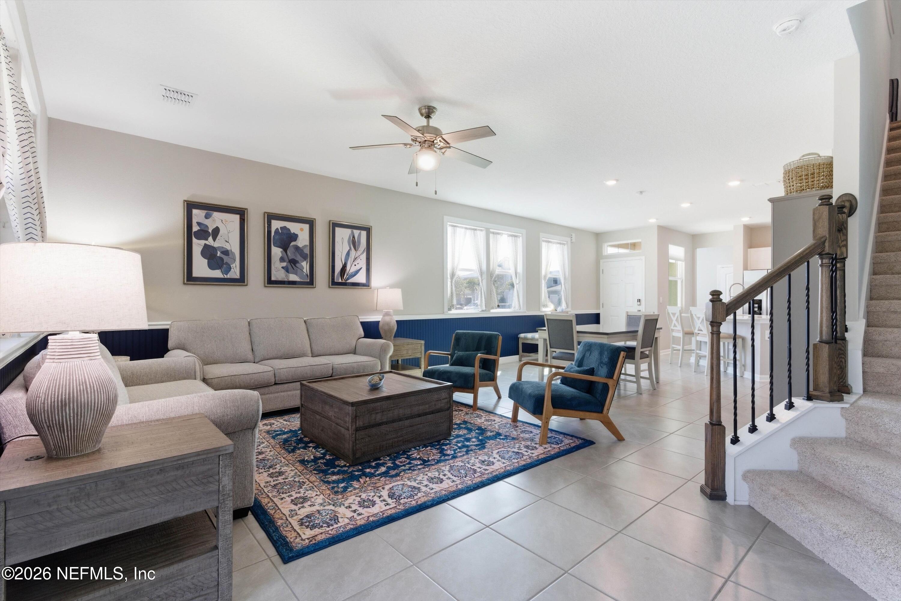 103 Seaport Breeze Road St. Augustine, FL 32095 - Photo 14 of 44 a living room with furniture and a ceiling fan