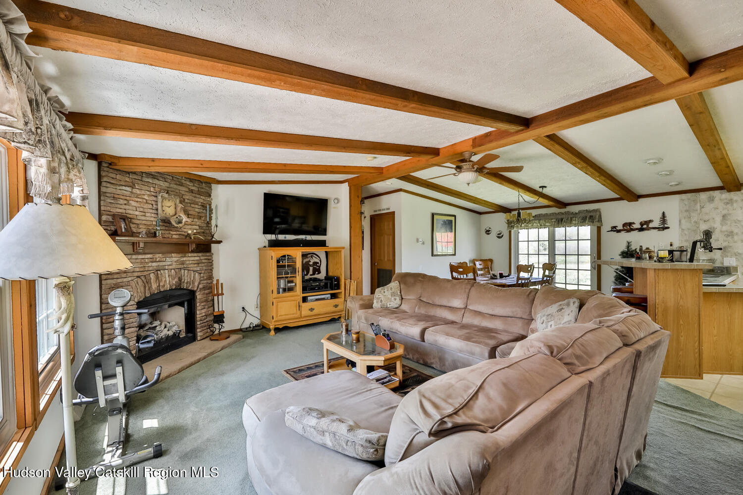 751 Mitchell Hollow Road Windham, NY 12496 - Photo 11 of 37 a living room with furniture and a fireplace