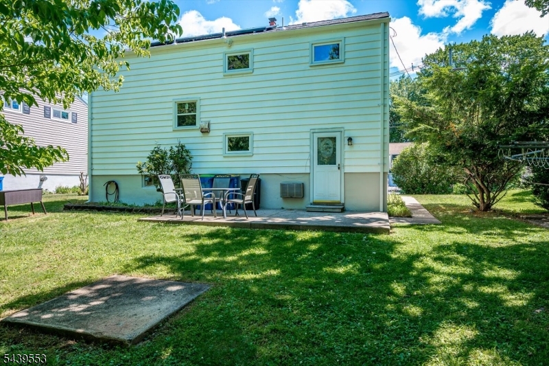 15 Woodmere Street Raritan, NJ 08869 - Photo 15 of 16 a view of a house with backyard and sitting area