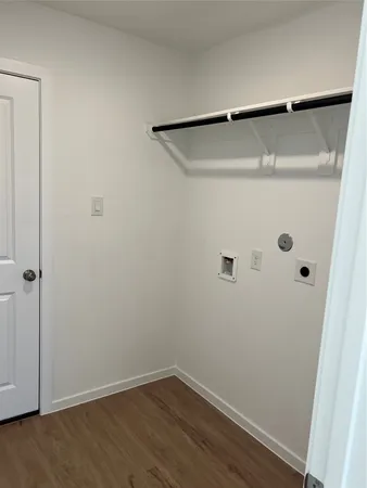 en empty room with windows and closet