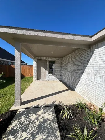 a kitchen with stainless steel appliances granite countertop a refrigerator a sink dishwasher a stove and a microwave oven on the wooden floor