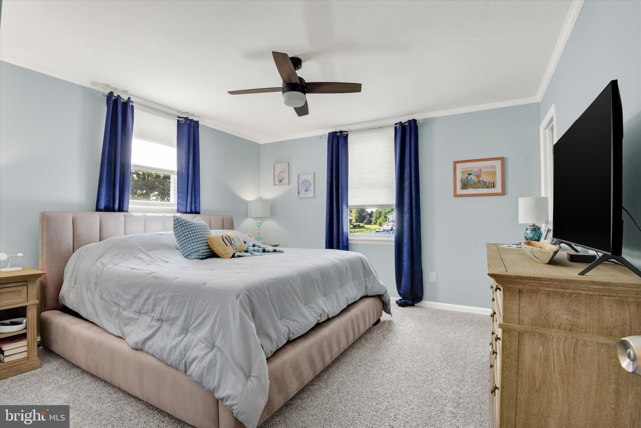 2116 Paddock Lane Finksburg, MD 21048 - Photo 12 of 35 a bedroom with a bed and a flat screen tv