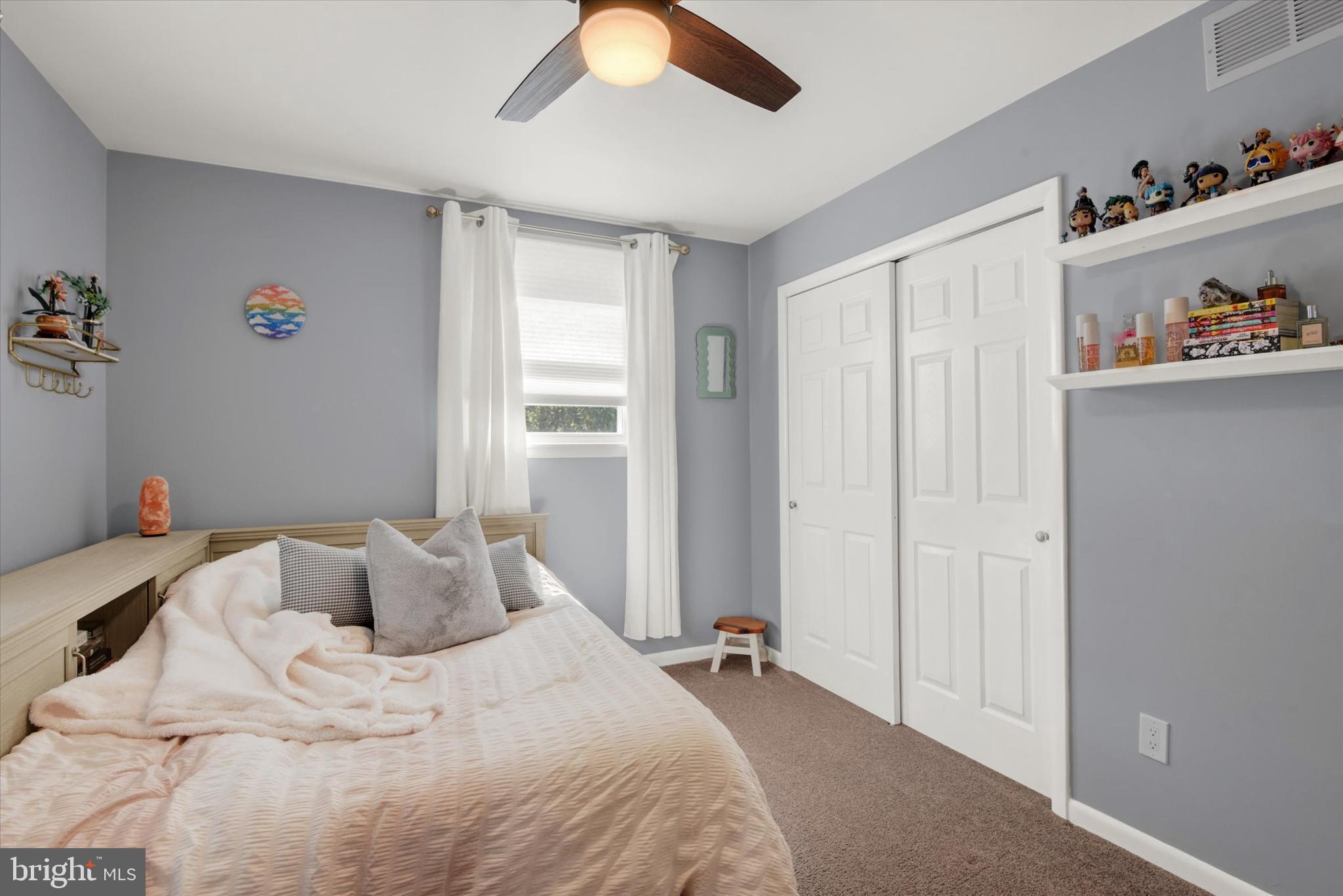 2116 Paddock Lane Finksburg, MD 21048 - Photo 16 of 35 a bedroom with a bed and a chandelier