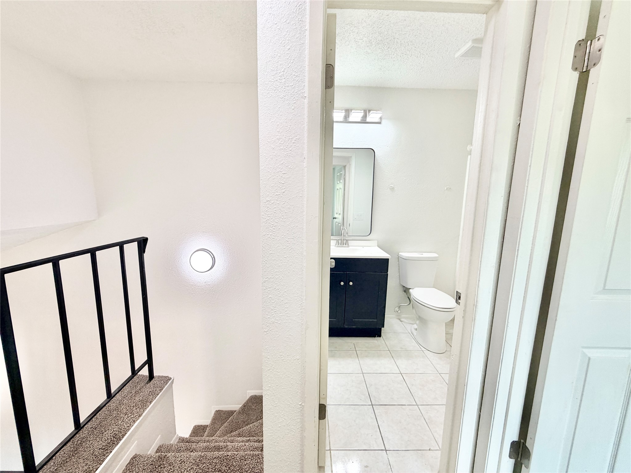 9623 Covey Ridge Lane Austin, TX 78758 - Photo 28 of 40 a view of a bathroom from a hallway