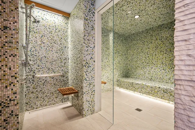 a bathroom with a shower and a sink