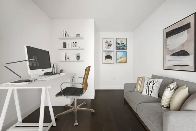 a work room with furniture and wooden floor