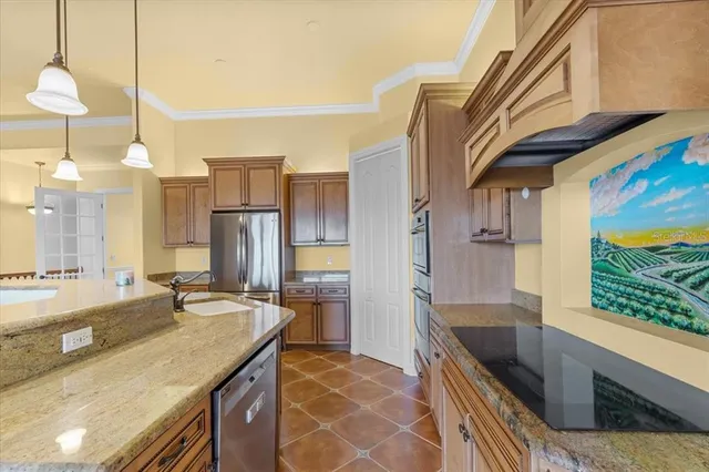 a kitchen with a sink a counter and chairs
