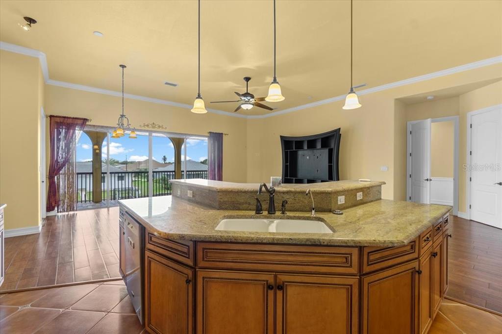 4301 Vasco Street Punta Gorda, FL 33950 - Photo 17 of 53 a kitchen with a sink a counter and chairs