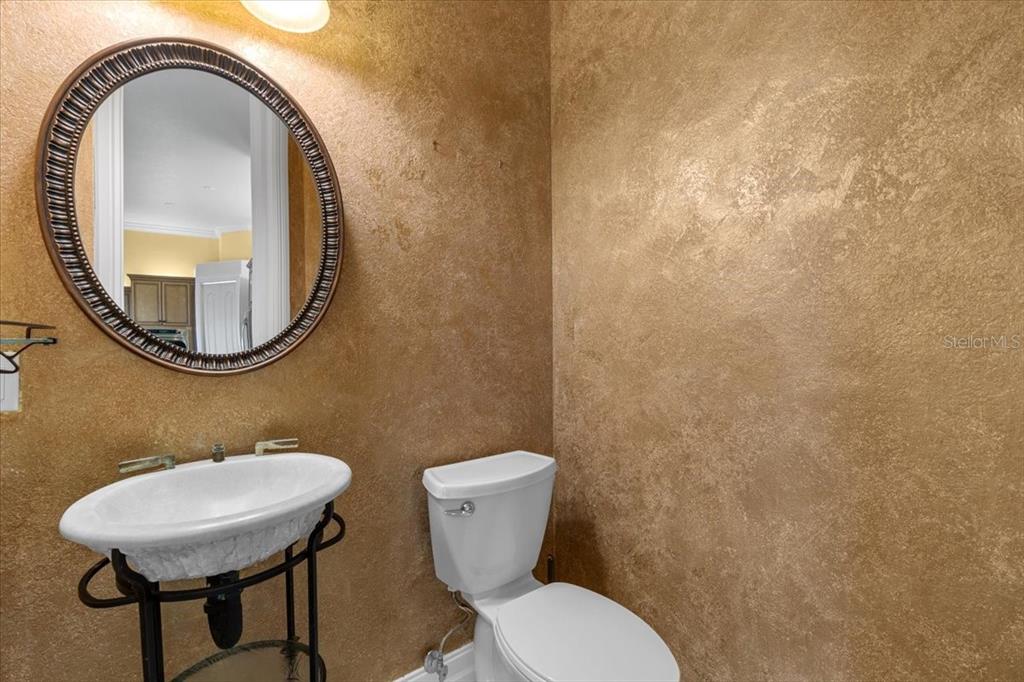 4301 Vasco Street Punta Gorda, FL 33950 - Photo 18 of 53 a bathroom with a toilet a sink and a mirror