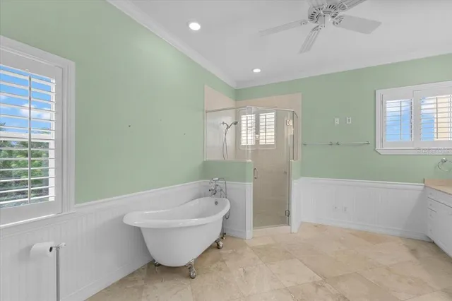 a bathroom with a bathtub sink and mirror