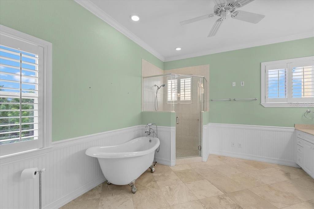 4301 Vasco Street Punta Gorda, FL 33950 - Photo 19 of 53 a bathroom with a bathtub and window
