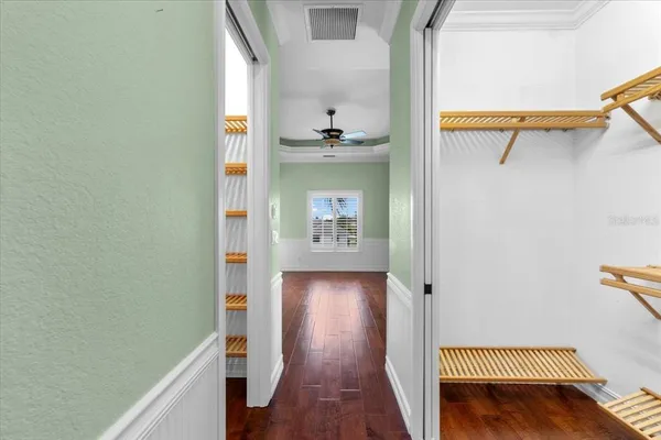 a close view of a room with stairs and wooden floor
