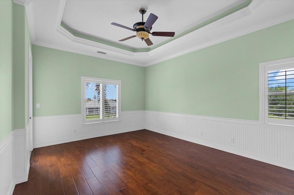 4301 Vasco Street Punta Gorda, FL 33950 - Photo 25 of 53 a view of empty room with wooden floor and fan