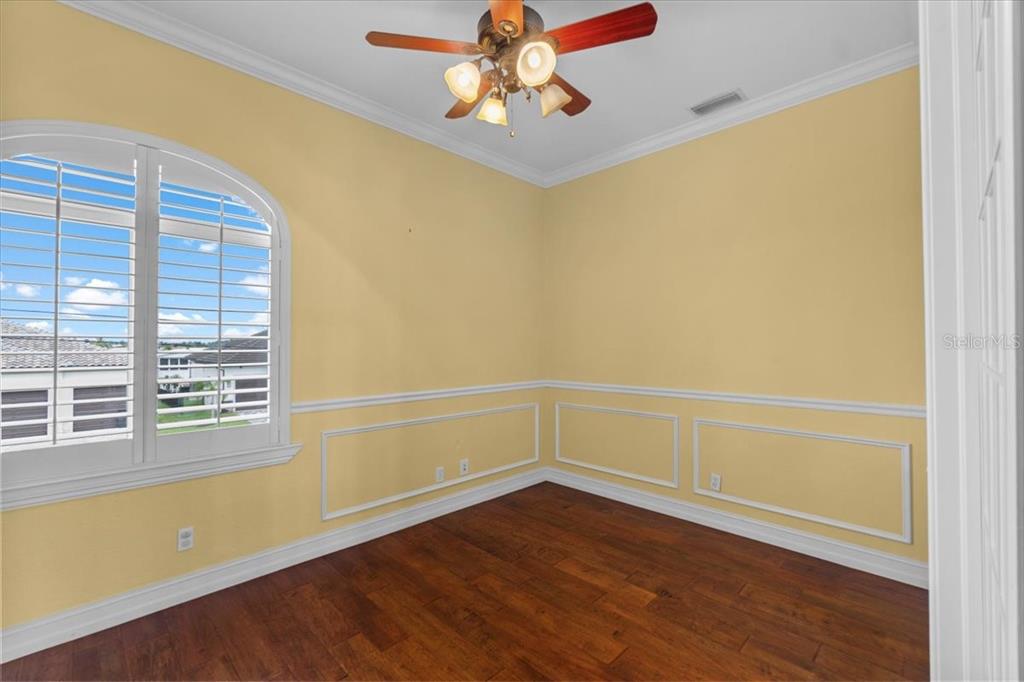 4301 Vasco Street Punta Gorda, FL 33950 - Photo 26 of 53 a view of an empty room with window and wooden floor