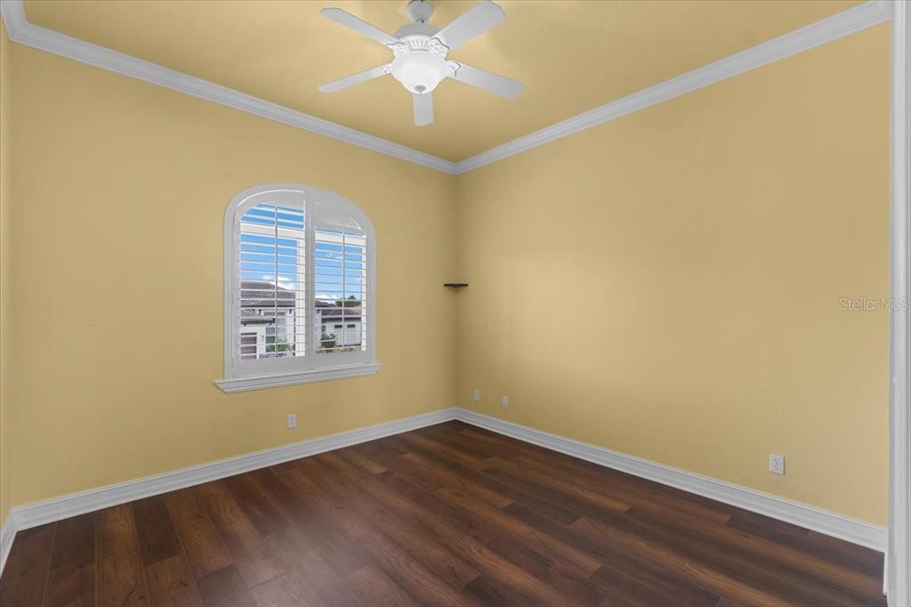 4301 Vasco Street Punta Gorda, FL 33950 - Photo 29 of 53 an empty room with a window and wooden floor