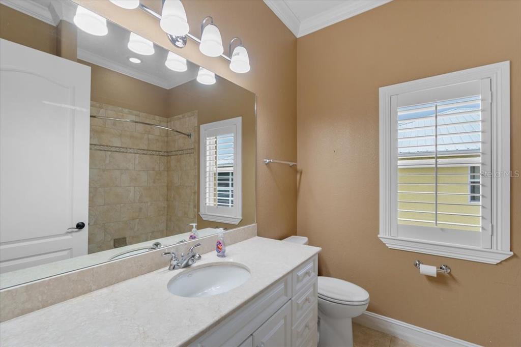 4301 Vasco Street Punta Gorda, FL 33950 - Photo 31 of 53 a bathroom with a sink a toilet and a mirror