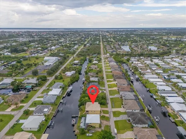 an aerial view of residential houses with outdoor space