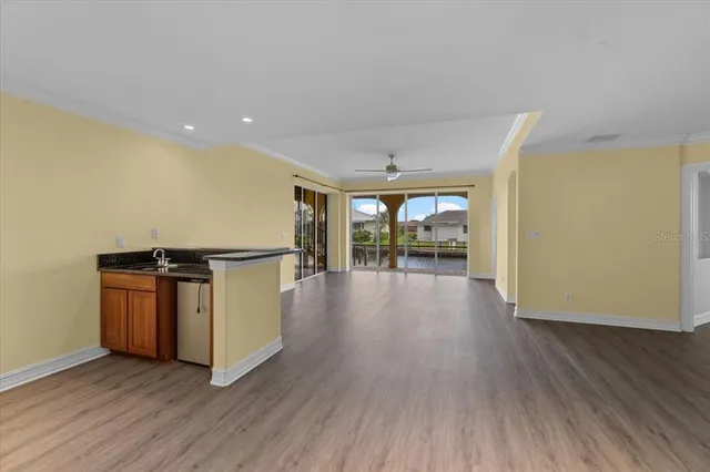 a view of a room with wooden floor
