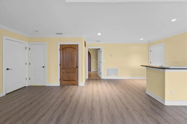 a view of a livingroom with wooden floor