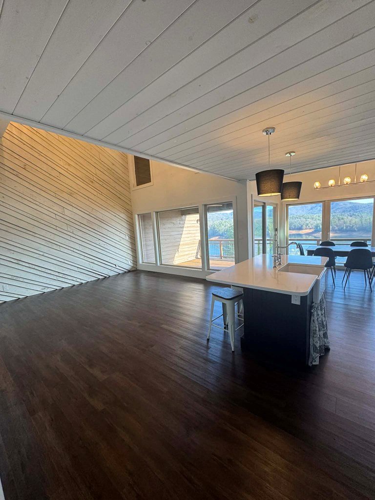 500 Marina Road Murphy, NC 28906 - Photo 11 of 57 a room with lots of wooden furniture and large windows