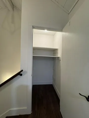 a bed room with a bed and a chandelier