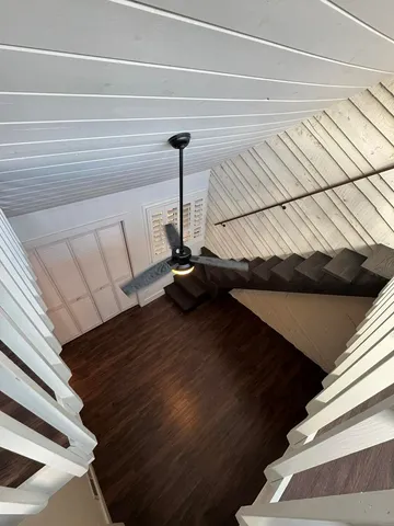 a view of a balcony with wooden floor and outdoor space