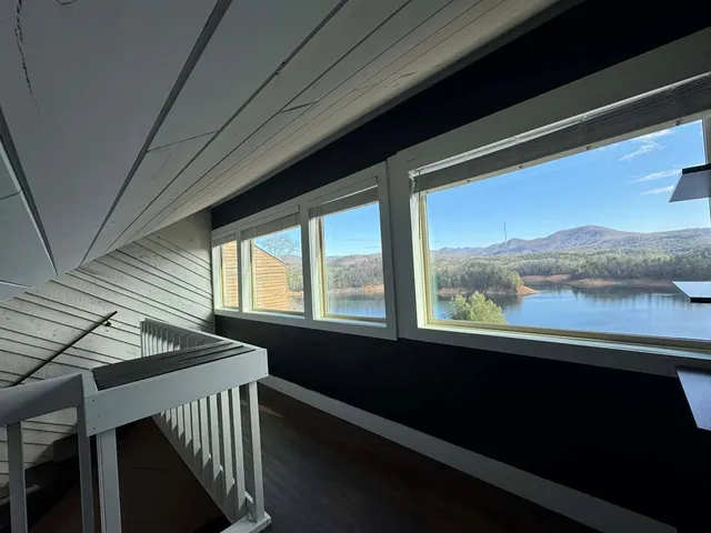 a view of a hallway with a hardwood floor