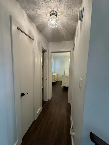 a view of a bathroom with wooden floor