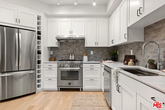 a kitchen with a stove microwave and refrigerator