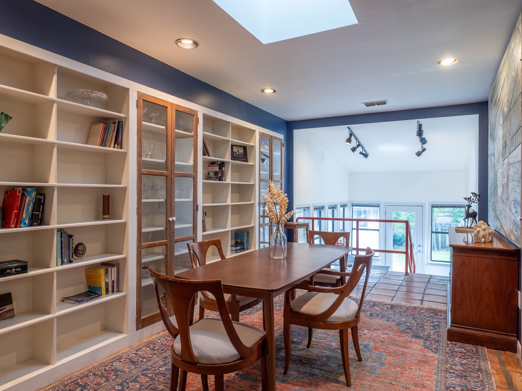 4617 Finley Drive Austin, TX 78731 - Photo 11 of 36 Dining room featuring track lighting, a skylight, tile patterned flooring, and recessed lighting