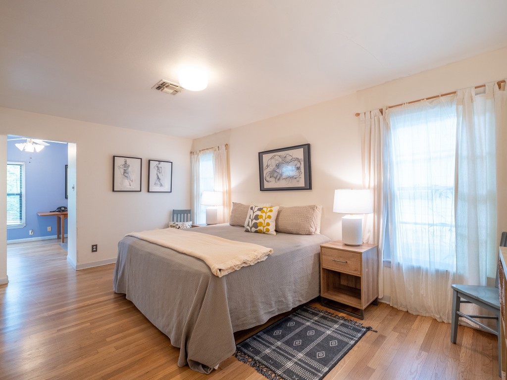 4617 Finley Drive Austin, TX 78731 - Photo 14 of 36 Bedroom featuring multiple windows and light wood-style floors
