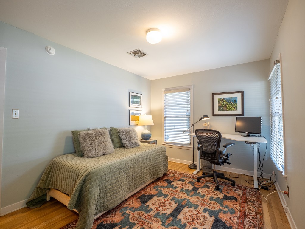 4617 Finley Drive Austin, TX 78731 - Photo 20 of 36 Bedroom with light wood-type flooring and a desk