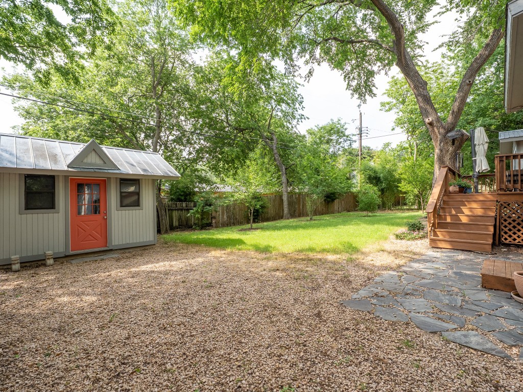 4617 Finley Drive Austin, TX 78731 - Photo 33 of 36 Fenced backyard with an outbuilding and a deck