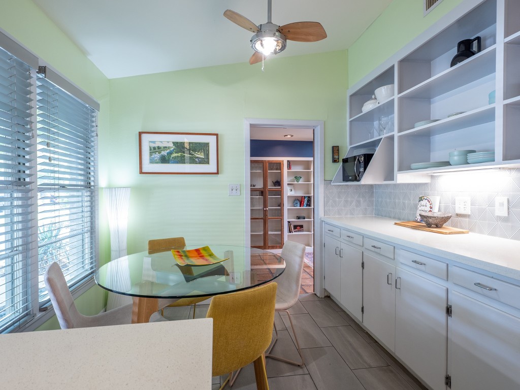 4617 Finley Drive Austin, TX 78731 - Photo 6 of 36 Dining space featuring vaulted ceiling, wood finish floors, and ceiling fan