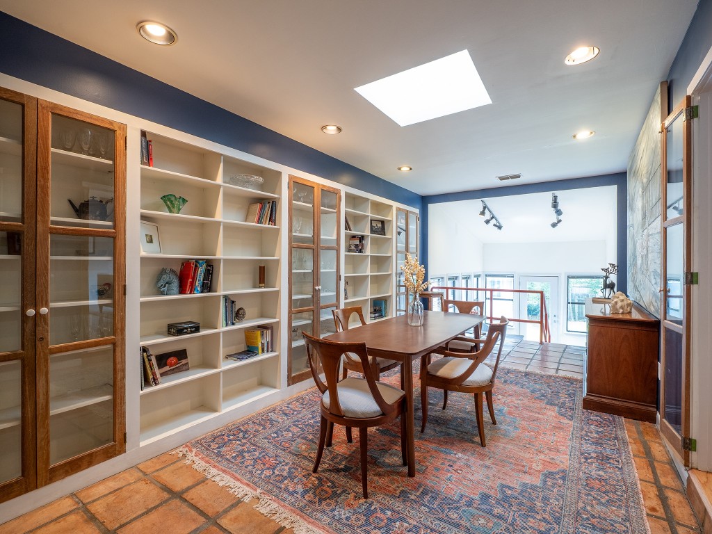 4617 Finley Drive Austin, TX 78731 - Photo 10 of 36 Dining space featuring a skylight, rail lighting, and recessed lighting