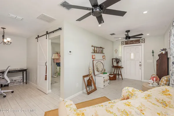 a bedroom with a bed a desk and chair