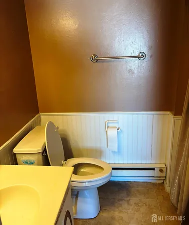 a bathroom with a sink and toilet