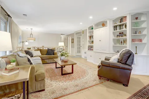 a living room with furniture window and a table