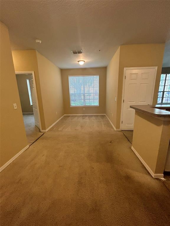 823 Grand Regency Point, Unit 102 Altamonte Springs, FL 32714 - Photo 12 of 12 a view of an empty room with a window