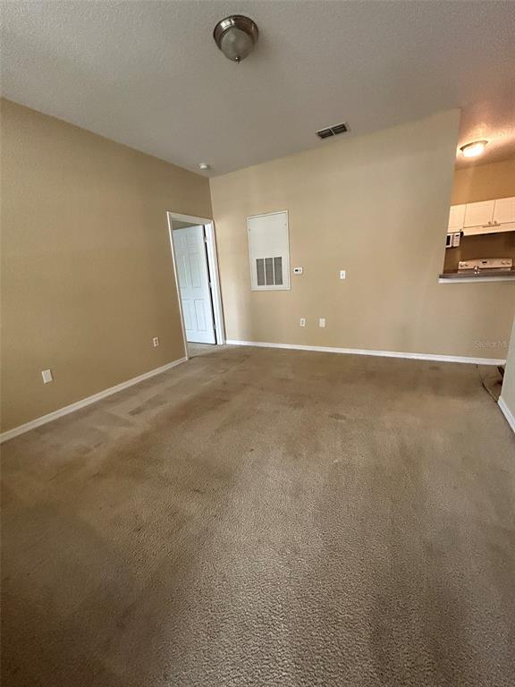 823 Grand Regency Point, Unit 102 Altamonte Springs, FL 32714 - Photo 4 of 12 a view of an empty room with a window