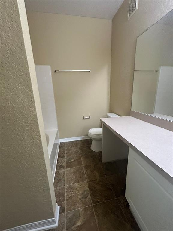 823 Grand Regency Point, Unit 102 Altamonte Springs, FL 32714 - Photo 6 of 12 a bathroom with a sink and a toilet