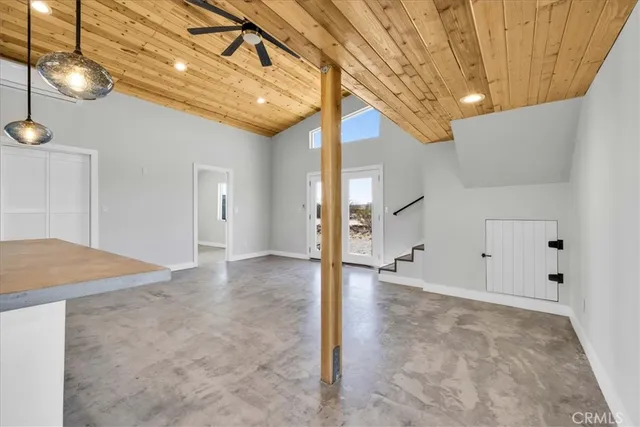 a view of a kitchen with furniture and staircase
