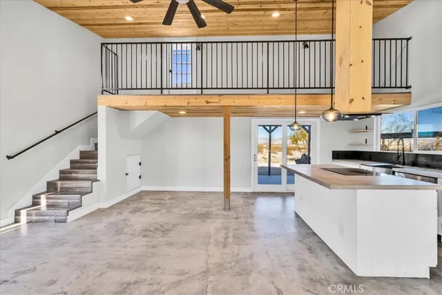 a view of an entryway with wooden floor and windows