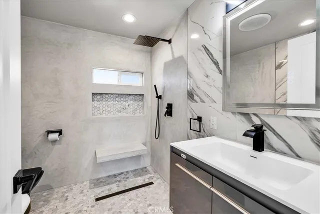 a bathroom with a bathtub and shower