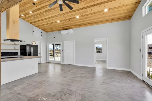 a kitchen with stainless steel appliances a stove a refrigerator a sink and cabinets