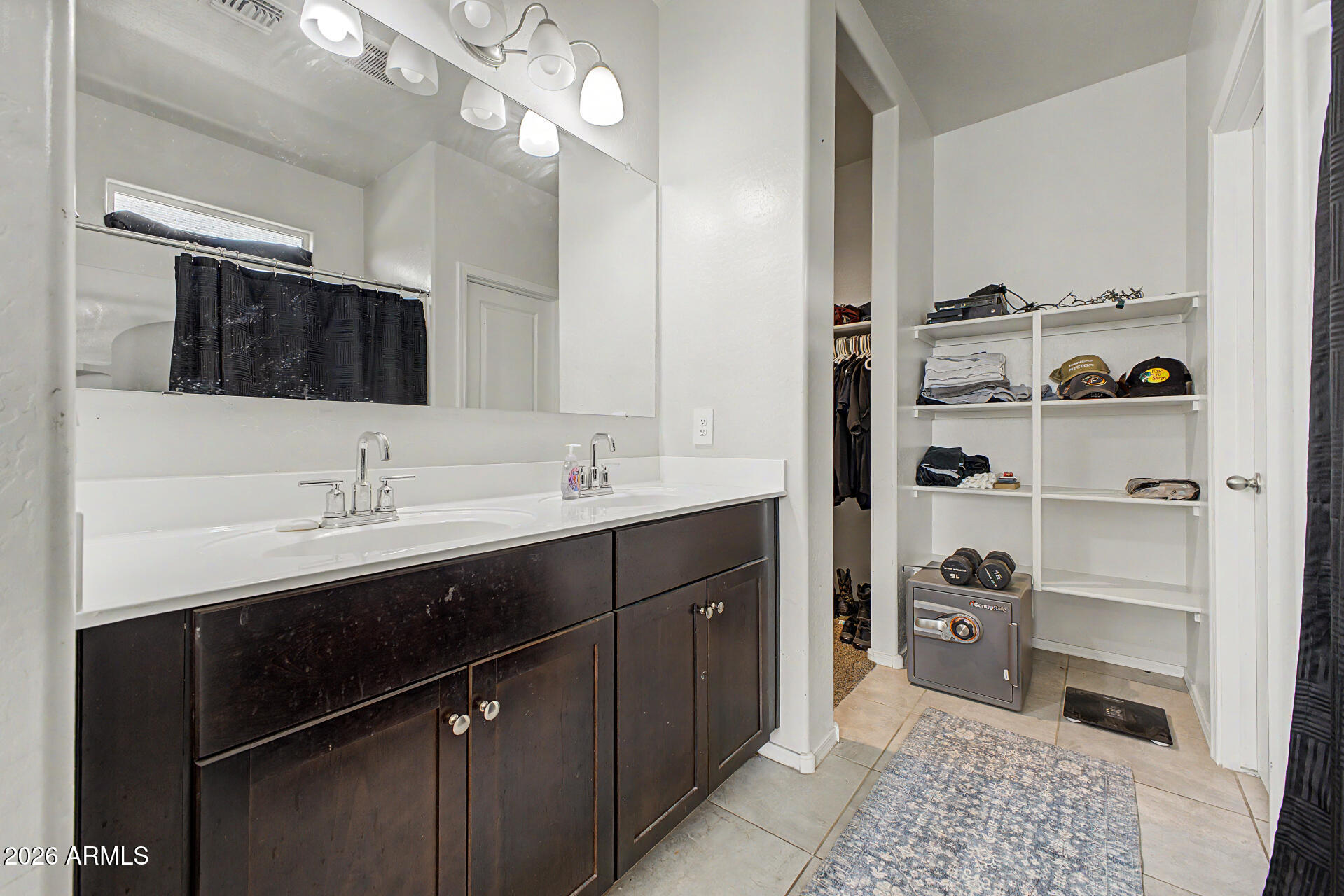 9345 Tangerine Road Florence, AZ 85132 - Photo 18 of 30 a bathroom with a sink double vanity and a mirror