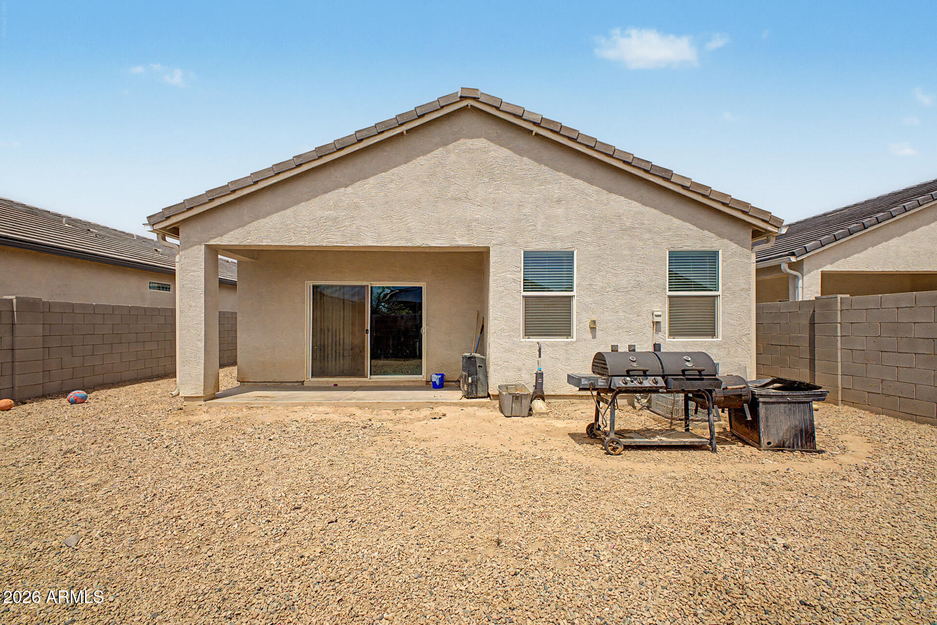 9345 Tangerine Road Florence, AZ 85132 - Photo 28 of 30 a backyard of a house with table and chairs
