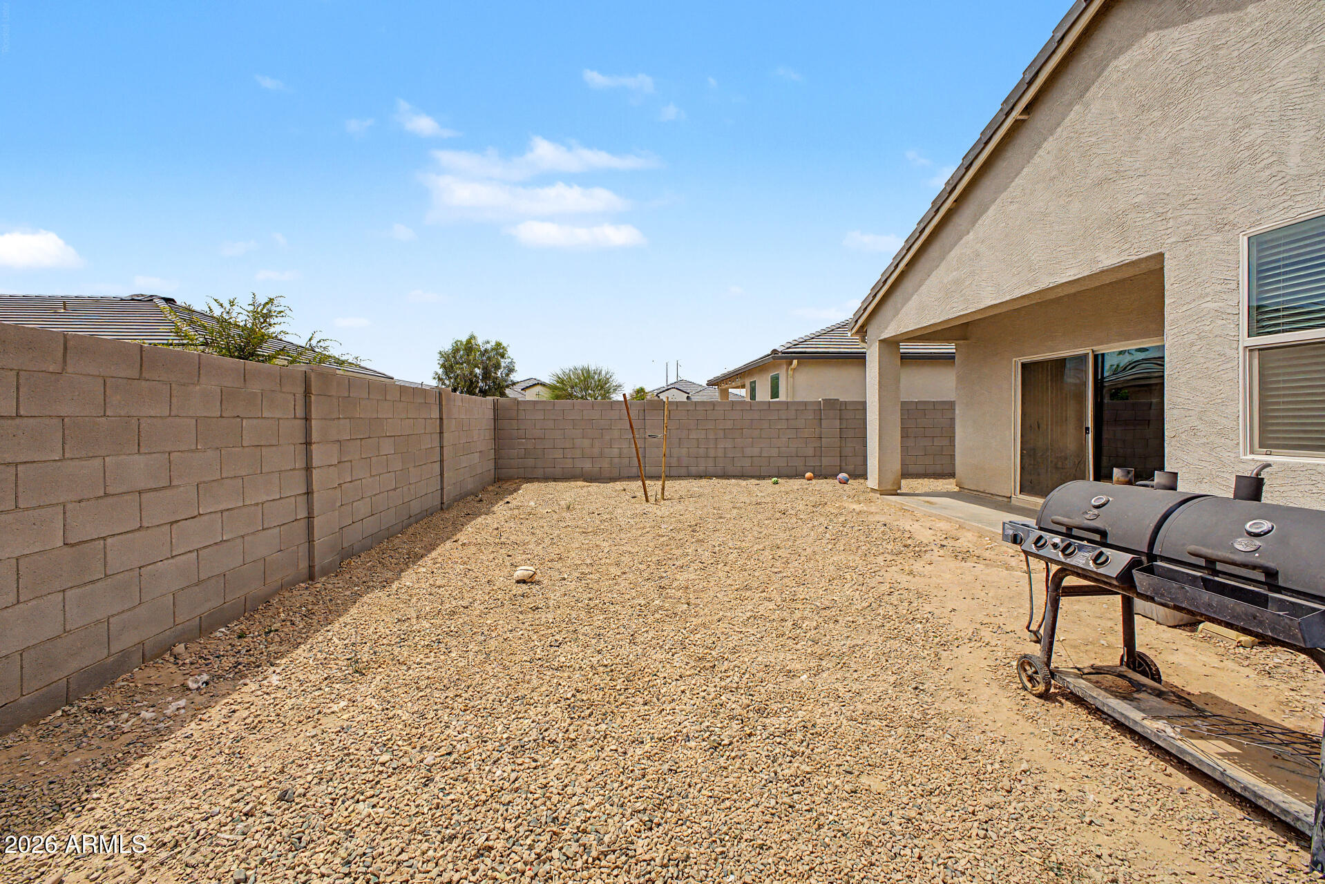 9345 Tangerine Road Florence, AZ 85132 - Photo 30 of 30 a backyard of a house with wooden fence